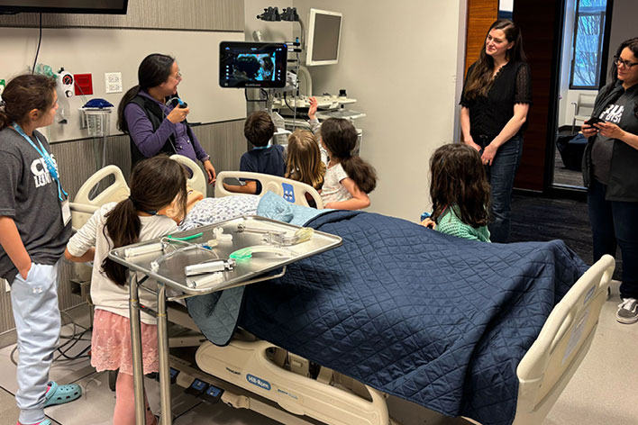 The simulation team leads a demonstration during Take Your Kids to Work Day