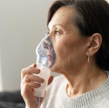 Woman using at-home oxygen therapy