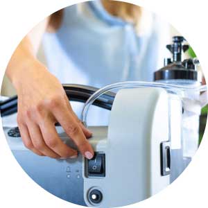 Person using a stationary oxygen concentrator