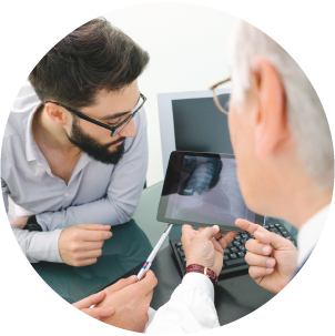 Two people reviewing a lung CT scan together
