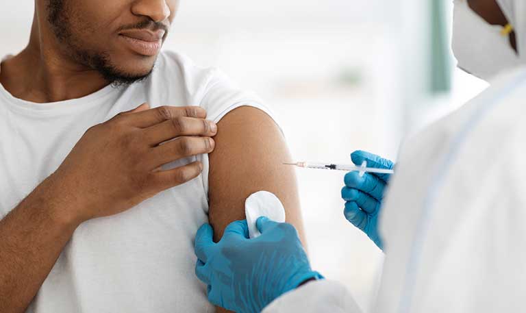 a person administers a vaccine