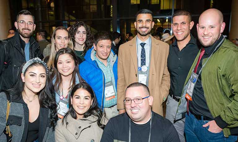 A group of smiling interest group members posing for a picture