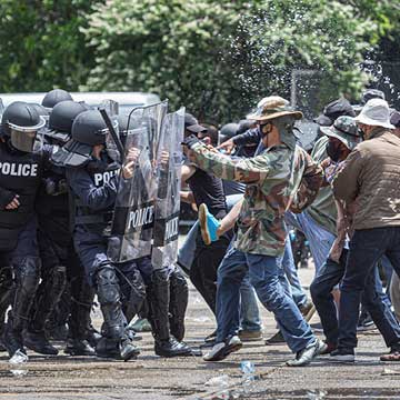 Police and civilians during a riot