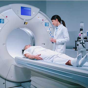 Patient receiving a CT scan in a hospital imaging suite